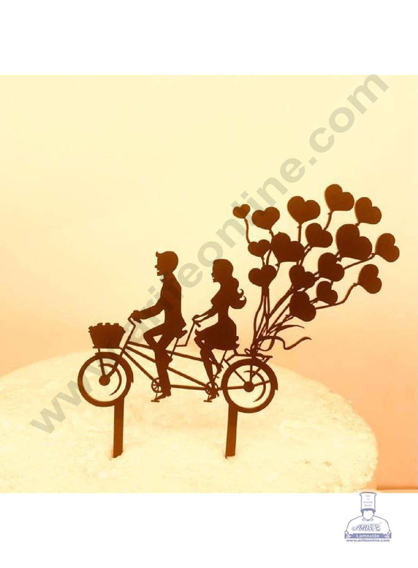 CAKE DECOR™ 5 inch Acrylic Cute Couple On Bicycle with Heart Shape Balloons Cutout Design Cake Topper Cake Decoration Dessert Decoration Black (SBMT-3031)
